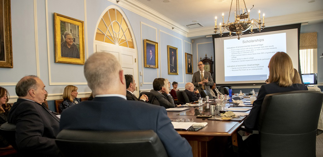 ECOTE members watch a presentation in their meeting room